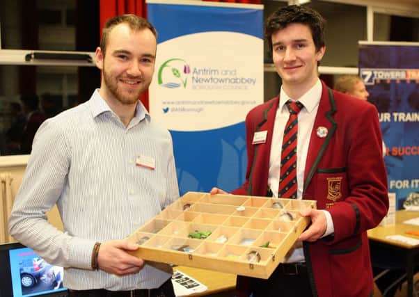 Paul Gollogly, student Environmental Health Officer with Antrim and Newtownabbey Borough Council, with Ballyclare High School pupil Michael Kerr at the Ballyclare Learning Community careers convention. Pic by Freddie Parkinson