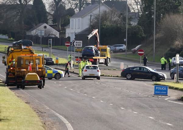 Police at the scene of the crash on the A26