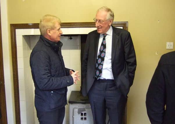Sandy Wilson, Vice Chairman of Broughshane & District Community Association discussing proposals for the former Police Station as a community asset with Donald Hoodless, Chairman, Northern Ireland Housing Executive Board. (Submitted Picture).