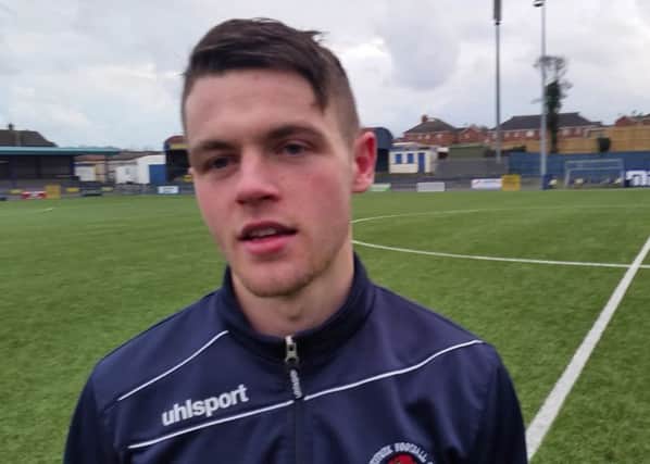 Institute midfielder Shane McGinty was a happy man after grabbing a hat-trick in their win over Bangor.