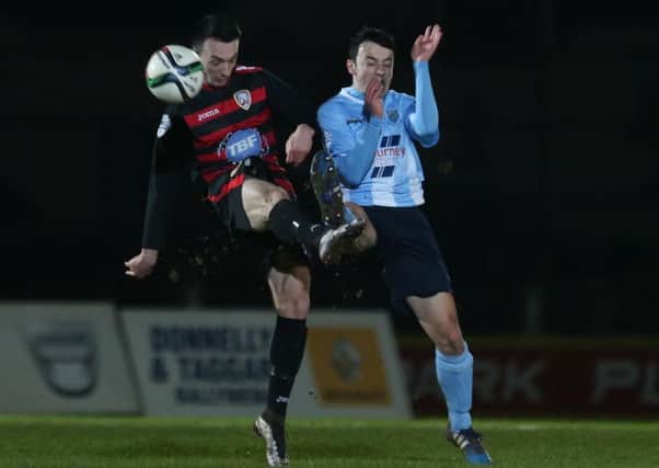 Jonny Frazer competes for a high ball with Coleraine's Mark Edgar during his Ballymena United debut on Friday night. Picture: Press Eye.