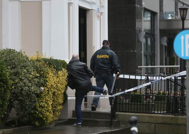 Gardai outside the Regency Hotel in Dublin after one man died and two others were injured following a shooting incident at the hotel.