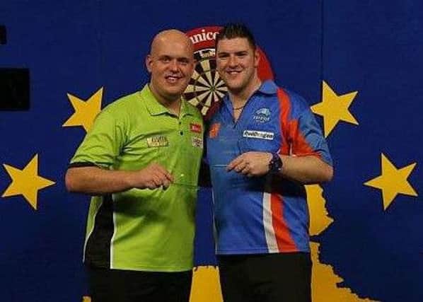 Daryl Gurney pictured with Michael Van Gerwen after the Dutch Darts Masters final. Picture courtesy PDC Europe
