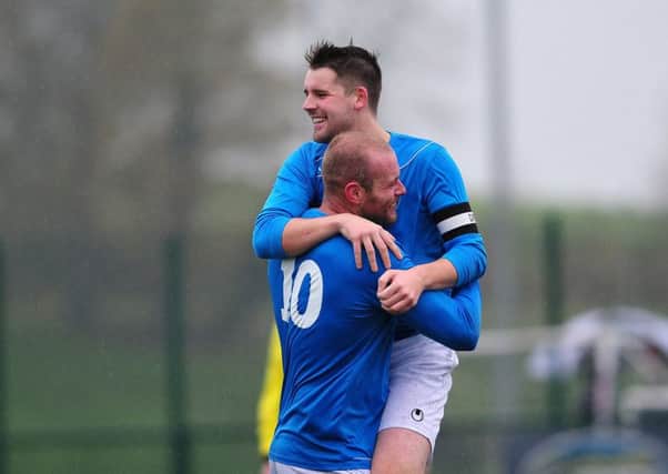 Killymoon Rangers Jamie O'Neill celebrates with team-mates after putting his side 2-0 up during last Saturday's local derby clash with Desertmartin at MUSA.INMM4715-358