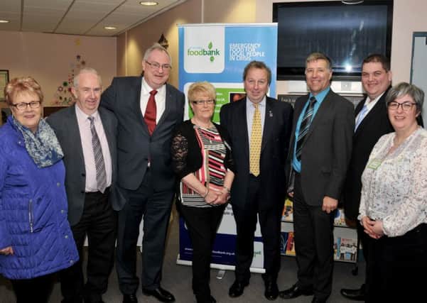 Councillor Vera McWilliam, Councillor Jim Bingham, Stephen Aiken, Mina McKinney, Danny Kinahan MP, Paul Girvan MLA, Councillor David Arthurs and Michele Purdy (Deaconess) at the official opening of the Ballyclare distribution centre. INNT 07-517CON