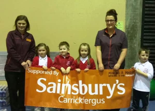 Anne Patterson and Louise Dempster, from Sainsburys Carrickfergus, with year 1 pupils of Woodburn Primary School during their Active Kids, Get Fit day. INCT 07-750-CON