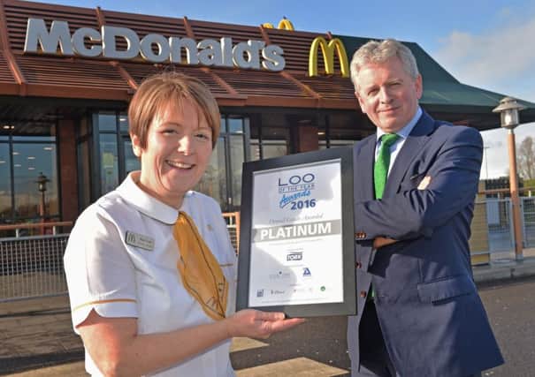 Rita Frost, Business Manager at McDonalds Sprucefield and Franchisee John McCollum show off their loos platinum status.