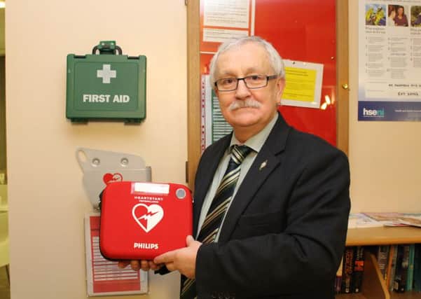 East Antrim MLA Oliver McMullan with a defibrillator. INLT-07-712-con
