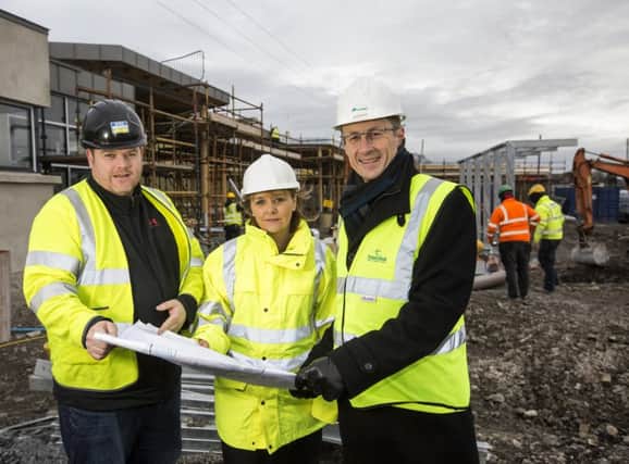 Pictured at the Banbridge site are Transport Minister Michelle McIlveen,  Clive Bradberry, Infrastructure Executive at Translink and Barry Taggart, building contractor BSG. Picture by Brian Morrison.