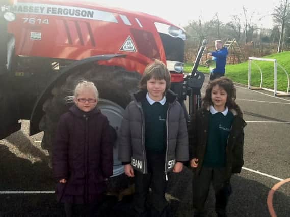 Meadow Bridge pupils meet a Massey Ferguson tractor as a launch of activities including a tractor run and school play.