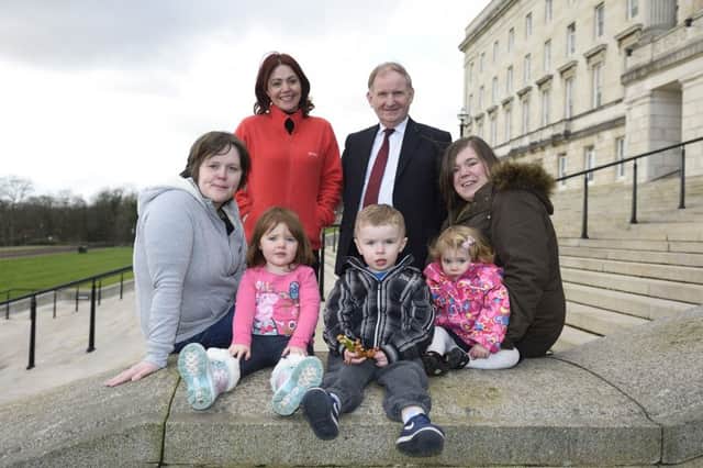 Pictured with Social Development Minister, Lord Morrow MLA and Gay Sherry-Bingham from Atlas Women's Centre are (left-right) Dawn and Yasmin Cairns, Nathan Gowdy and Darcey and Carly Hawk. Picture: Michael Cooper