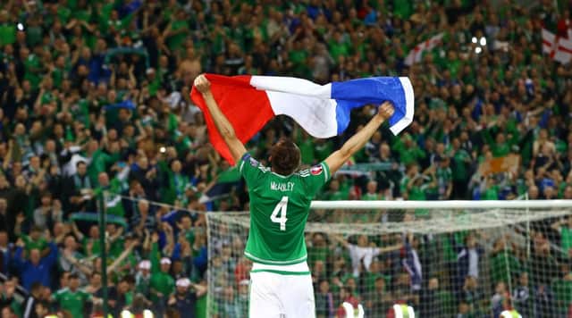 Gareth McAuley celebrates Northern Ireland qualifying for the Euro Finals for the first time in their history.