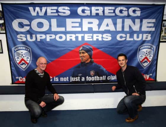 Chris Gregg pictured with the banner of the new Wes Gregg Coleraine Supporters Club. Included left is Wes' brother Dennis. wk42008mb