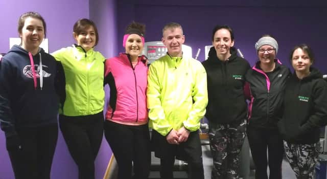Pictured is Amber Getty with running mates from Ironfist Gym in Ballymoney. Amber recruited the gym members to form a relay team for the Deep RiverRock Belfast City Marathon in aid of Mencap. inbm9-16s