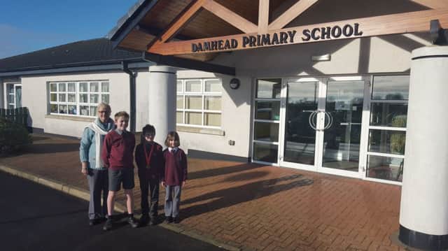 Damhead PS Principal, Mrs N Reilly, pictured with Matthew, Paul and Catherine.