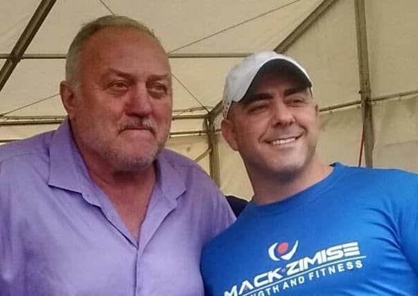 World's Strongest Man Bill Kazmaier is pictured with Randall Crooks of  Mackzimise
