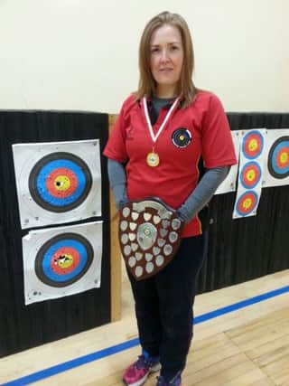 Joanne Walker underlined her status as a ladies' barebow specialist with two gold medals and a Northern Ireland record.