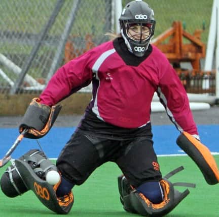 KNEESY DOES IT. Ballymoney's No.1 stopper, Jodie Shannon, pictured in action against Queens on Saturday.INBM8-16 018SC.