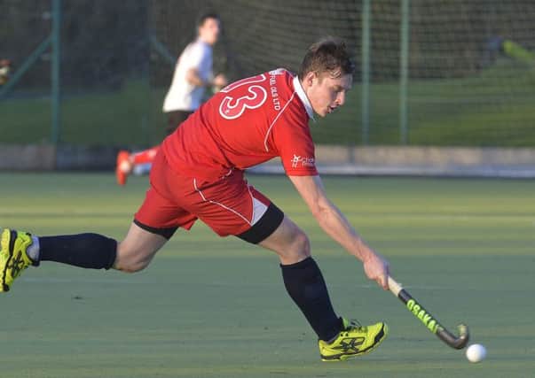 Mandatory Credit: Rowland White / PressEye
Men's Hockey: Premier
Teams: Annadale (white) v Cookstown (red)
Venue: Lough Moss
Date: 3rd January 2015
Caption: Jon Ames, Cookstown