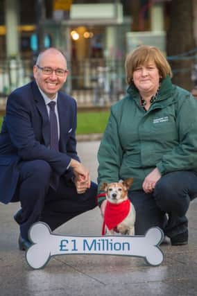 Pic L-R: Danske Bank Chief Executive, Kevin Kingston with Crosskennan Lane Animal Sanctuary volunteer, Carmel Walsh and rescued dog, Poppy.