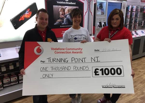 Members of local charity Turning Point NI are celebrating after receiving Â£1,000 from Vodafone UK. Turning Point NI collected the Vodafone Community Connection Award last week after staff in its Ballymena store chose the local charity to receive the funds. (Submitted Picture).