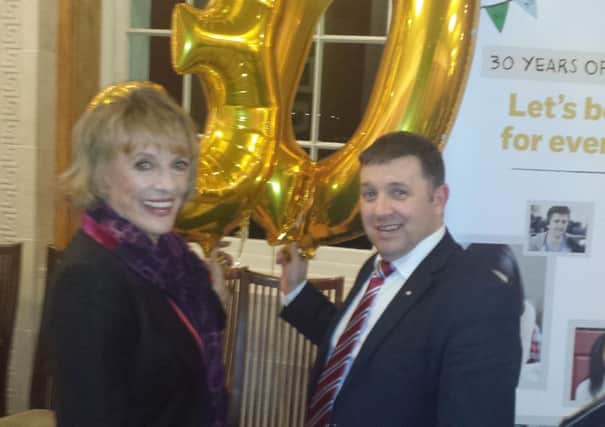 UUP MLA Robin Swann with Dame Esther Rantzen, the founder and president of Childline, at a special Stormont function to mark 30 years of the organization. (Submitted Picture).