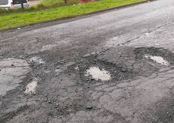 The large potholes outside Larne MOT centre. INLT-08-706-con
