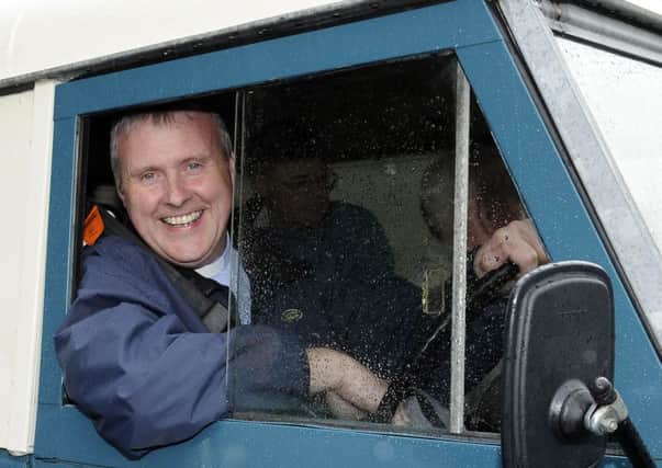 Rev David Somerville sets off in his Land Rover on the Ballyward Parish Church Vintage Road Run in aid of Southern Area Hospice Services