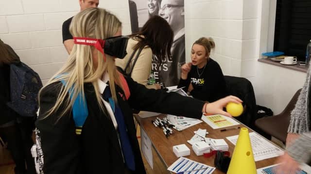 Carrickfergus College pupil Charley Robinson tries the 'Beer Googles' test at the Youth Fair. INCT 19-701-CON