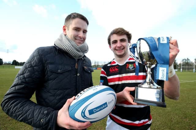 Banbridge Academy's Michael McGaffin shows off the Trophy along with Andy Donaldson, Danske Bank Mallusk Branch manager