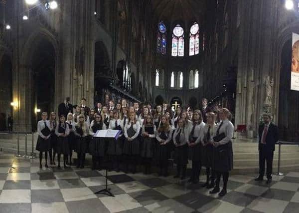 Members of Carrickfergus Grammar School Music Society perform inside Notre Dame cathedral.  INCT 09-723-CON