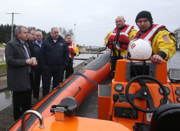 Minister of State at the Department for Transport Robert Goodwill MP enjoys a welcome "cuppa" as members of the Lough Neagh Rescue crew give him a run down of the workings of their rescue vessel. INBT 09-305JC