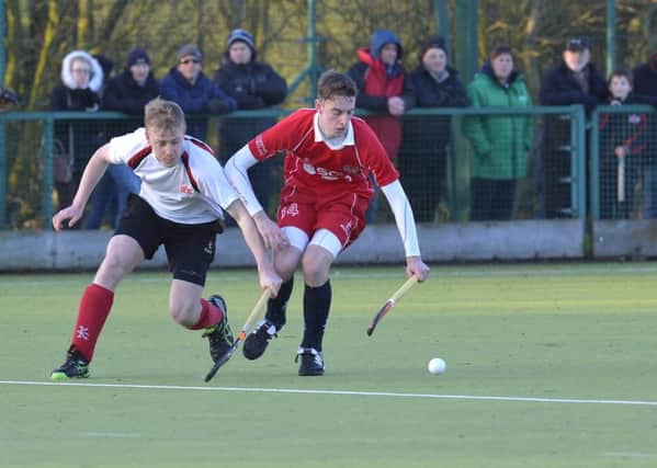 Cookstown's Andy McWhirter keeps the ball away from Matthew Allister of Annadale