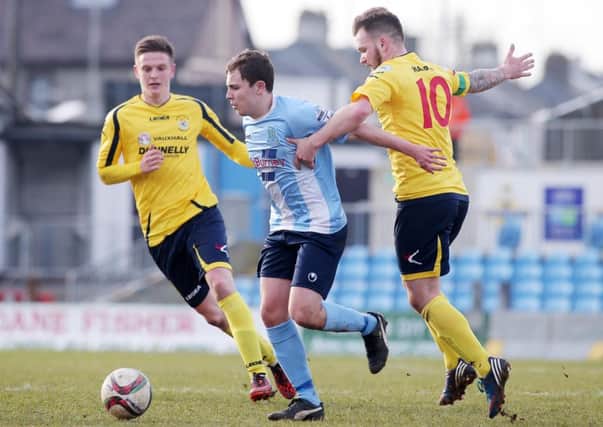 Ballymena United's Eoin Kane with Dungannon's Douglas Wilson (left) and Ryan Harpur. 
Picture by Jonathan Porter/PressEye