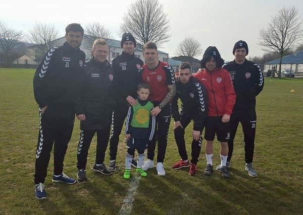 This young Derry City supporter is pictured along Cristian Delgado, Conor McCormack, Aaron Barry, Jordan Allan, Nathan Boyle, Keith Ward and Shaun Patton.