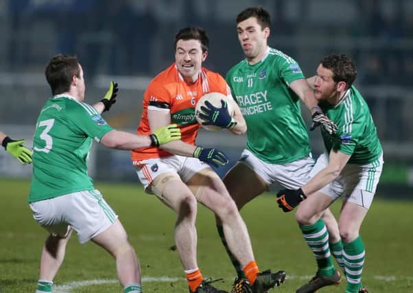 Aidan Forker of Maghery under pressure on duty for Armagh against Fermanagh.