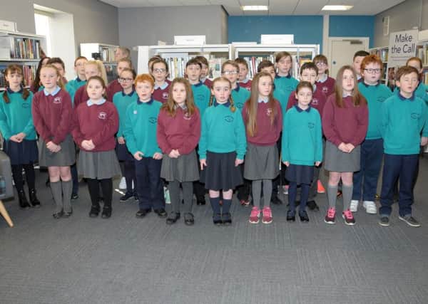 Entertaining at the Official Opening of Carnlough'sLibrary and Community Facility are the joint choir of St. John's PS and Carnlough Integrated PS. INLT 09-216-AM