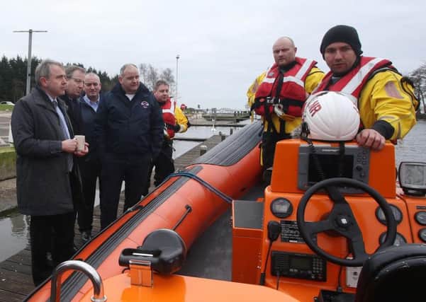 Minister of State at the Department for Transport Robert Goodwill MP enjoys a welcome "cuppa" as members of the Lough Neagh Rescue crew give him a run down of the workings of their rescue vessel