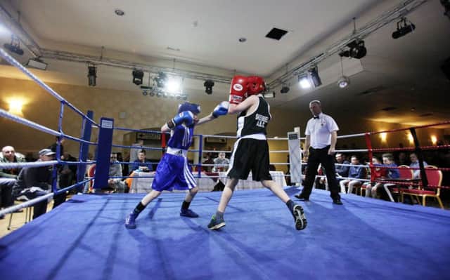 Leon Boyd (Coleraine ABC) and Peter Passmore (Skerries) in action during the Skerries ABC Fight Night held at the Magherabuoy Hotel on Friday. INCR9-319PL