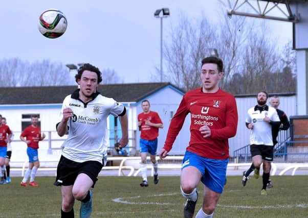 Action between Lisburn Distillery and Ards US0916-411PM Pic by Paul Murphy