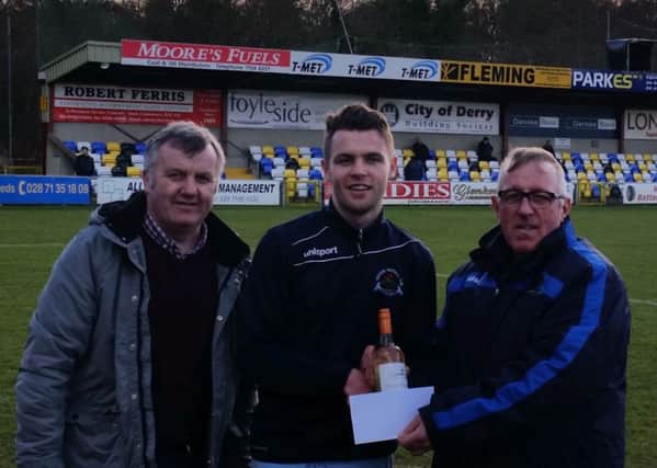Ian Culbert (left) and Ivan Rutherford present Shane McGinty with the Institute Supporters Player of the Month award, before Saturday's win over Lisburn Distillery.