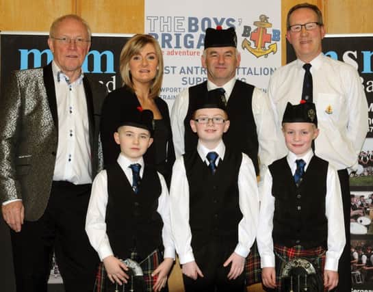 L to R: (back row) Paul Briggs and Sheelagh Greer, Ballyclare Male Choir, John Fittis, Major Sinclair Memorial Pipe Band and Drew Buchanan MBE, president of the East Antrim Battalion and (front row) William Currie, Lee Moran and Oliver McIlwaine. INCT 09-701-CON. Photo by John Kelly.