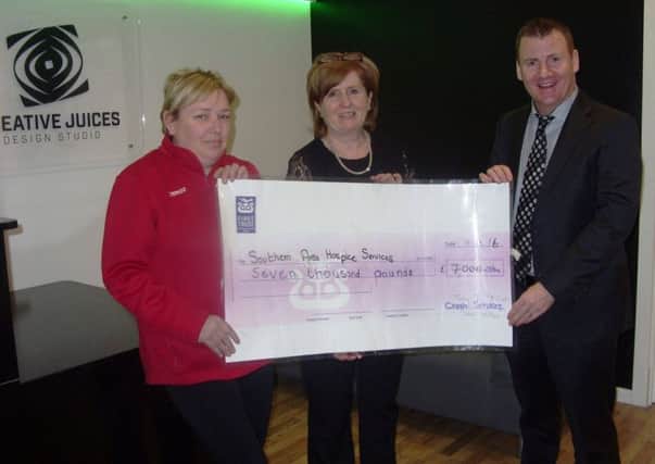 Lurgan Park Fun Runs raises Â£7,000 for the Southern Area Hospice Services.   L-R Edel Foy, Tesco with Deirdre Breen, Lurgan Hospice Fundraising Group and Tony McKeown of CRASH Services at the cheque presentation to the Hospice from their event held on Sunday 28th February.
