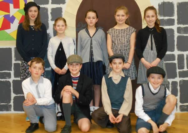 Primary 7 children in costume for the play.