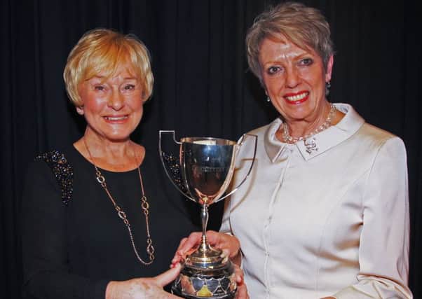 Theatre 3 Newtownabbey's Maureen Dunn (left), receives the Vin Smith Memorial Trophy for Best Producer, from Jan Palmer Sayer, festival adjudicator.