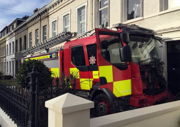 The stolen fire engine was driven into cars and houses in Larne, Co Antrim