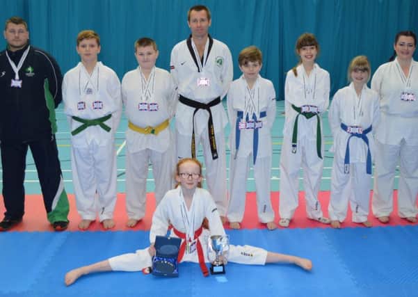 Coach Peter Stewart with members of Lisburn Taekwondo Club who took part in the British Championships.