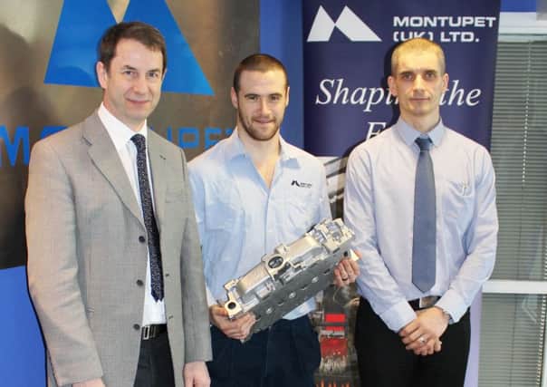 Ashley Johnston is completing his Higher Level Apprenticeship in Mechatronics Engineering at Monutpet UK Ltd in Derriaghy at South East Regional College (SERC) in Lisburn. Pictured left to right are Ken McKinstry, SERC Curriculum Leader, Ashley Johnston and Jim Hegarty, Montupet Training Manager.