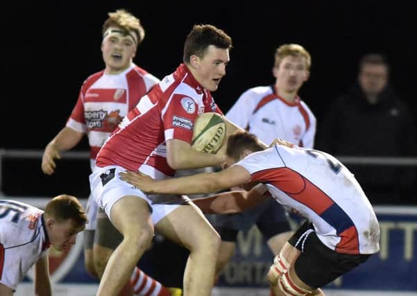 Randalstown's Michael O'Connell
 in action during his side's Nutty Krust floodlit tournament win over Malone last week. Picture: Tony Hendron.
