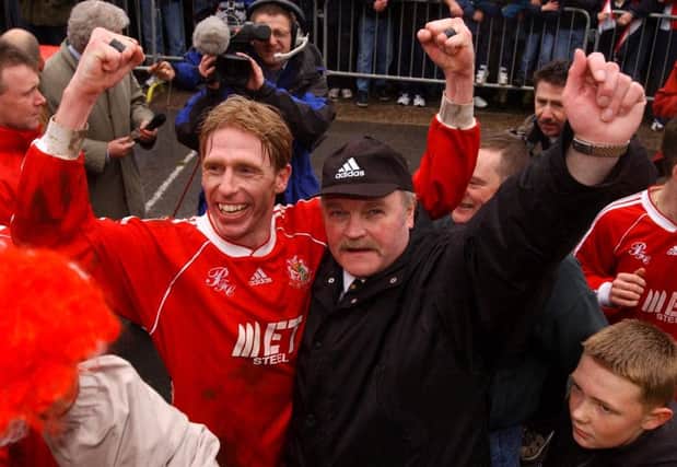 Vinny Arkins and Ronnie McFall celebrate the club's Irish League title triumph in 2002. Pic by Pacemaker Ltd.